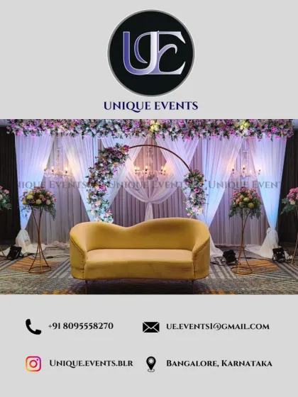 This is an example of a modern and elegant stage design perfect for a reception or engagement party. I combined a clean, circular floral arch with soft white curtains and classic chandeliers to create a sophisticated focal point for the couple.