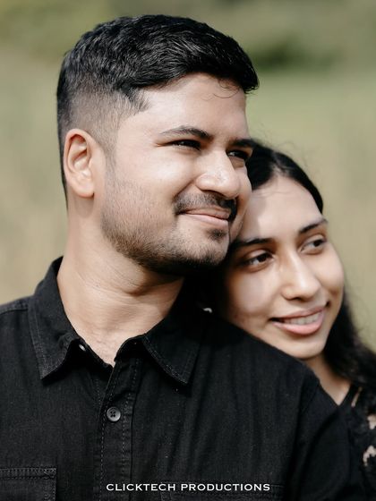 A close-up, intimate portrait of a couple, capturing a quiet and affectionate moment.