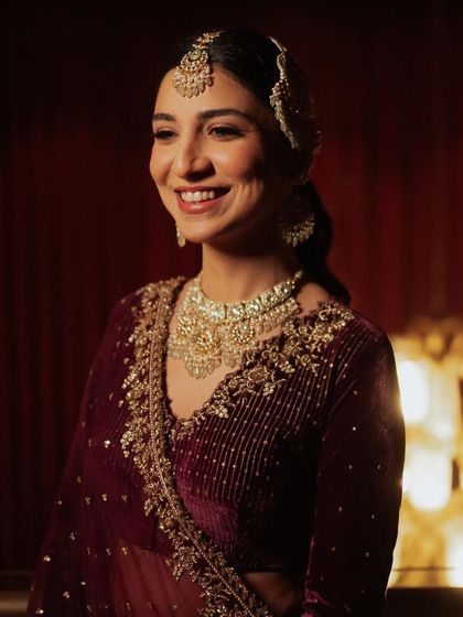 A sweet and simple reception look for this lovely bride. We chose a slicked back wavy ponytail, a pinch of pink in her eye makeup, and glossy lips for a subtle, glowing finish.