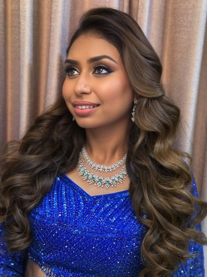 A dramatic sangeet look featuring a bold blue sequined outfit. I created a glamorous smokey eye and voluminous curls to match the high-energy vibe of the event.