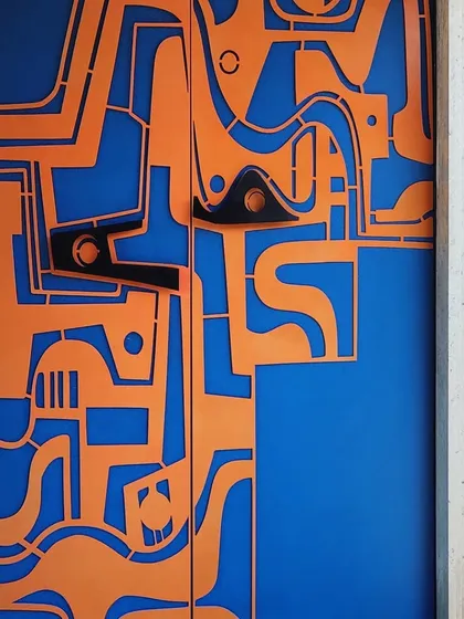 A detailed shot of the abstract, biomorphic handles we designed for this functional art door. Every component is crafted to be both an ergonomic part of the door and a sculptural element in its own right.