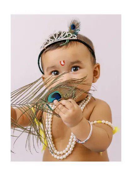 I love creating special themed shoots, like this 'Little Krishna' portrait for Janmashtami. It’s a beautiful way to celebrate tradition and create a truly unique and adorable memory.
