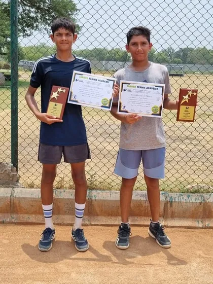 Anay Pandey and his doubles partner after winning the Under-14 doubles title at the Championship Series Tournament in Sonepat.