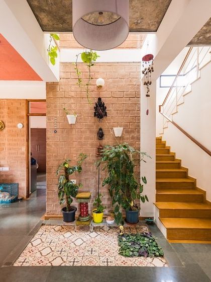 The central courtyard in the Samvrruddhi home, filled with plants. This small green space acts as the lungs of the house, bringing nature, light, and fresh air right into the heart of the home.