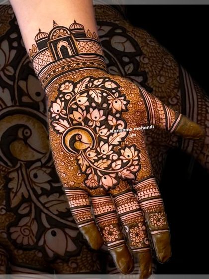 A heavy siders design featuring a detailed peacock surrounded by lotus flowers. The architectural element at the wrist completes this artistic piece.