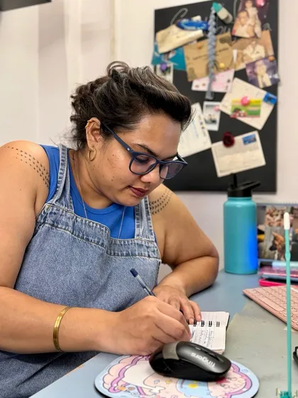 A glimpse of me at my desk, taking down orders and planning the baking schedule. The admin side of running a bakery is just as important as the baking itself.