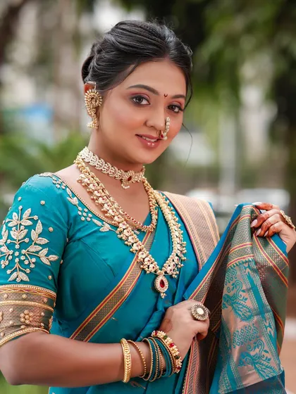 This full-length view showcases the beautiful saree draping, another essential skill we teach in our professional course.