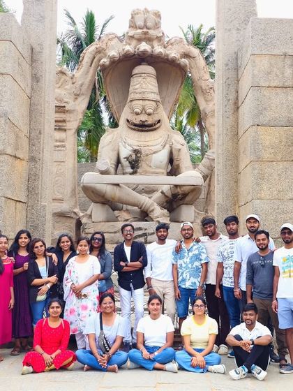 The group posing in front of the Ugra Narasimha statue in Hampi.