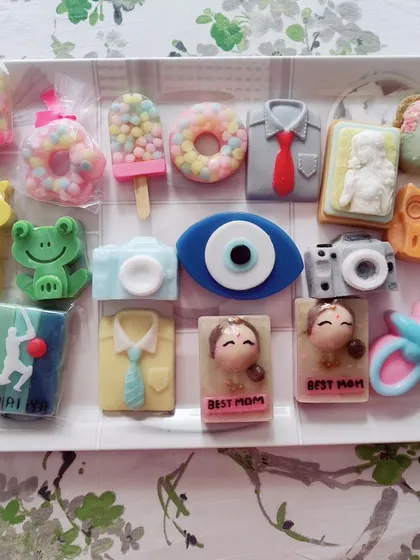 A tray showcasing the wide variety of soap designs I can create, from kids' themes to adult gifts.