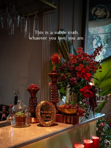 Another example of our detailed bar styling. Deep red florals, antique-style candle holders, and a marble countertop create a moody, sophisticated, and luxurious feel.