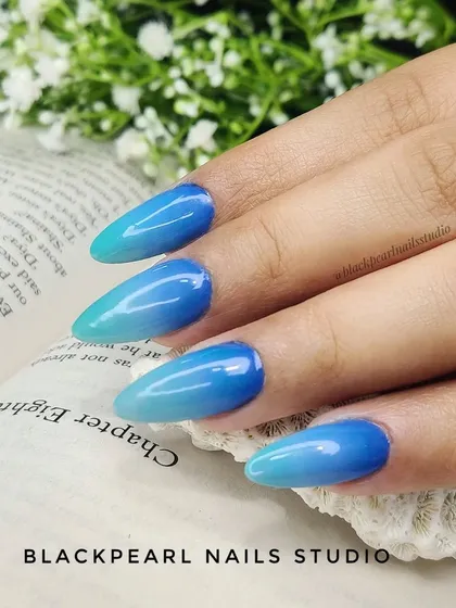 A beautiful example of a blue ombré, with shades that transition from a deep blue to a light seafoam green. This gradient effect is perfect for creating an ocean-inspired look.