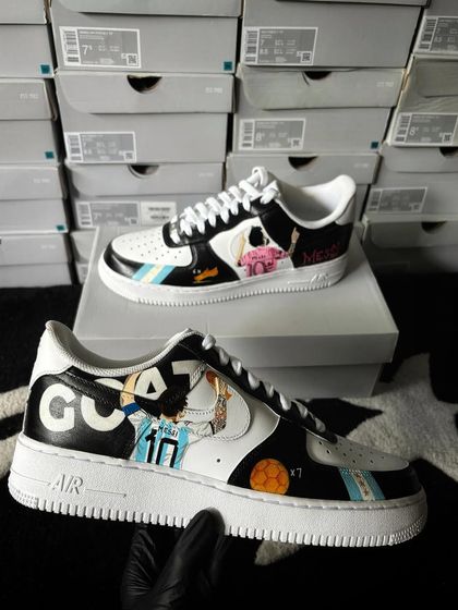 The Messi custom sneakers held up, showing both the Argentina and club designs.