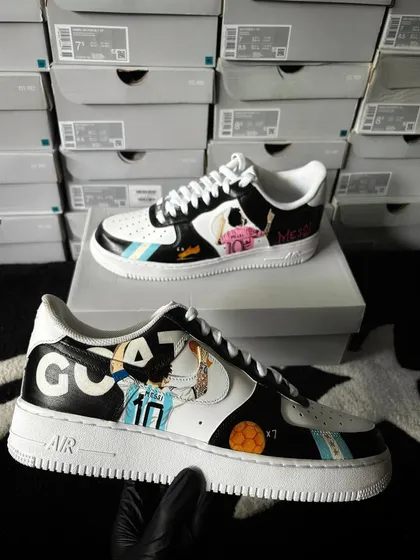 The Messi custom sneakers held up, showing both the Argentina and club designs.