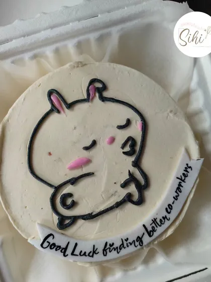 A funny and memorable farewell cake for a coworker. The design features a cute character with the message "Good Luck finding better co-workers," making for a sweet and sassy send-off.