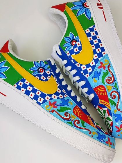 Another view of the mismatched truck art AF1s, showing how the yellow and blue swooshes contrast with the green and blue panels. It’s all about creating something unexpected.