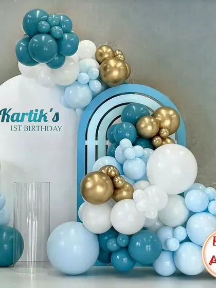 I pay close attention to color and composition, as seen in this beautifully balanced decor for Kartik's first birthday.