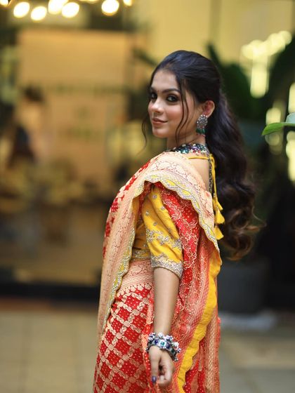 A beautiful shot of the model looking over her shoulder, giving a great view of her wavy ponytail.