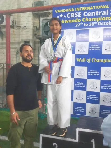 A proud coach-student moment after securing a silver medal and a spot in the nationals at the CBSE Central Zone tournament.