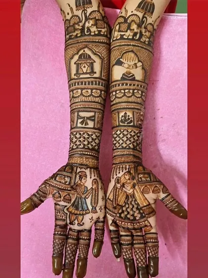 A classic bride and groom design, with the figures on the palms and traditional wedding motifs like the doli and elephants on the arms.