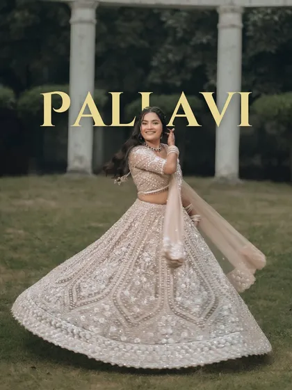 A bride's joy is radiant, and we love capturing that perfect twirl. This portrait is all about celebrating her elegance and happiness, with her lehenga in full, beautiful motion, creating a timeless image of bridal grace.