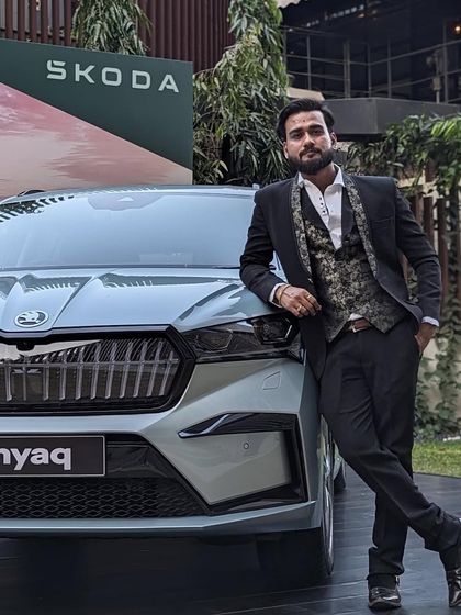 Posing with the new Skoda Enyaq after my performance for their annual dealer conference. My art is often used to add a creative touch to major brand launches.
