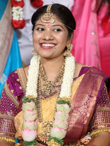 The joy of the ceremony. Our happy bride Vinutha is all smiles, wearing a traditional temple jewellery set with a unique matha patti design.