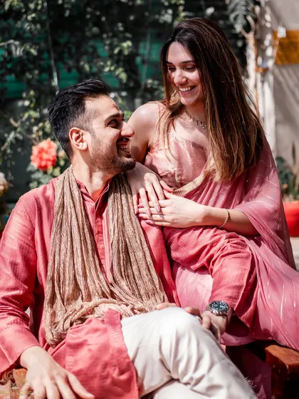 A sun-kissed moment of affection during a pre-wedding shoot. The natural light and genuine smiles make this a timeless portrait of love.