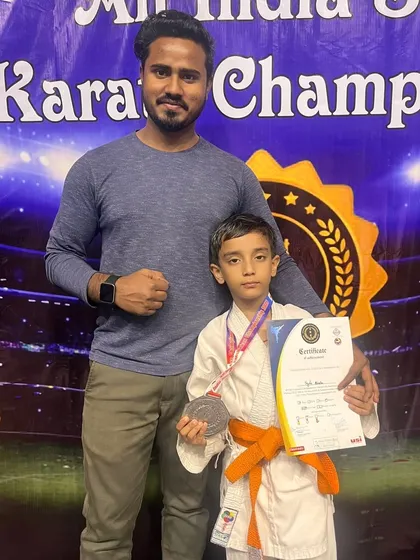 Standing with one of our silver medalists at the All India Karate Championship. Every competition is a learning experience on the path to becoming a better fighter.