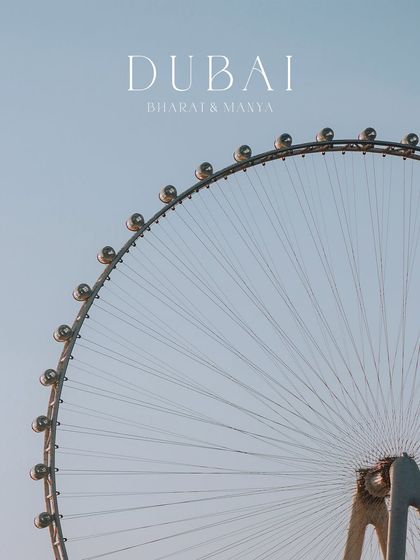 A minimalist shot focusing on the iconic Ain Dubai ferris wheel, serving as a perfect title card or establishing shot for a Dubai pre-wedding album.