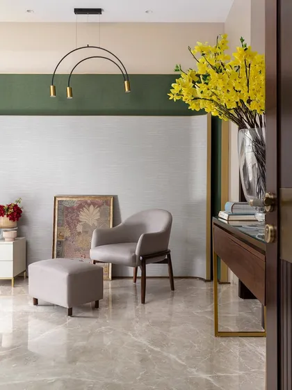 The view from the doorway into the green-accented bedroom, showing how the color blocking on the wall creates a sophisticated and modern architectural feature.