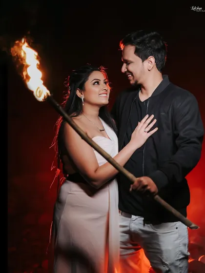 A dramatic night shot using a torch for a fiery effect. This is a great example of how I use creative lighting and props to create stunning, memorable images.