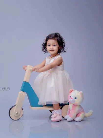 A calm and sweet pose from the scooter session. The simple props and background ensure that your child is always the star of the photograph.