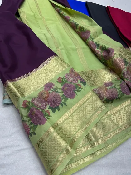 The elegant lime green and deep purple semi-Mysore crepe saree.