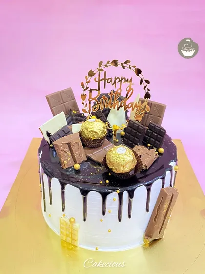 You can never have too much chocolate. My Chocolate Overload cake is pure indulgence, featuring a rich drip, and topped with an assortment of chocolates like Ferrero Rocher, KitKat, and Dairy Milk.