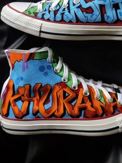 A pair of Converse high-tops customized with vibrant graffiti art for actor Aparshakti Khurana.