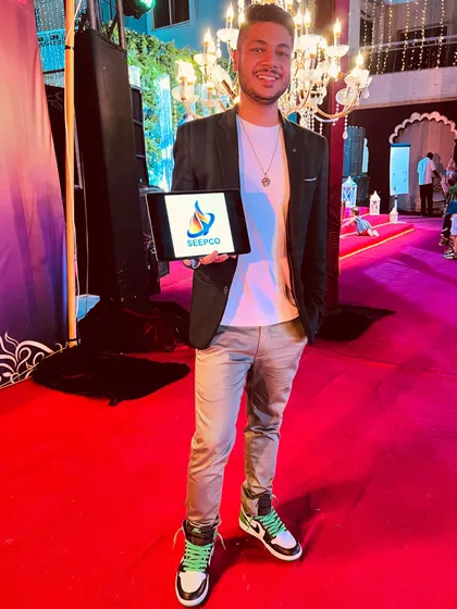 Performing in Africa with my custom iPad magic. This act allows me to display any company's logo, like SEEPCO's here, making it a powerful tool for brand integration anywhere in the world.