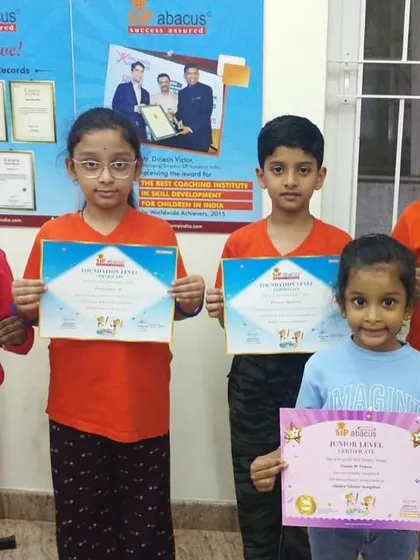 A mix of junior and foundation level students celebrating their certification. It's great to see the younger ones starting their journey with such enthusiasm.
