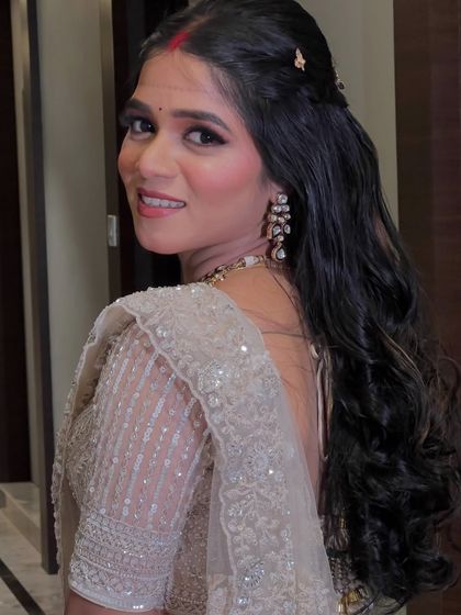 A side profile of the bride, her hair and makeup looking perfect from every angle.