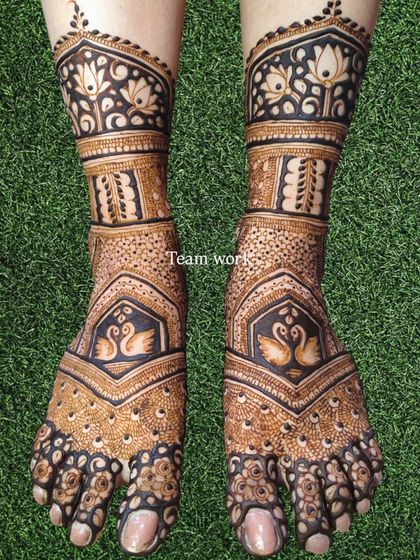 The swan-themed foot design shown on a natural green background, highlighting the beautiful contrast.