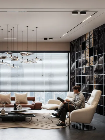 This view of the waiting area shows a person reading, adding a human element and demonstrating the comfort of the space.