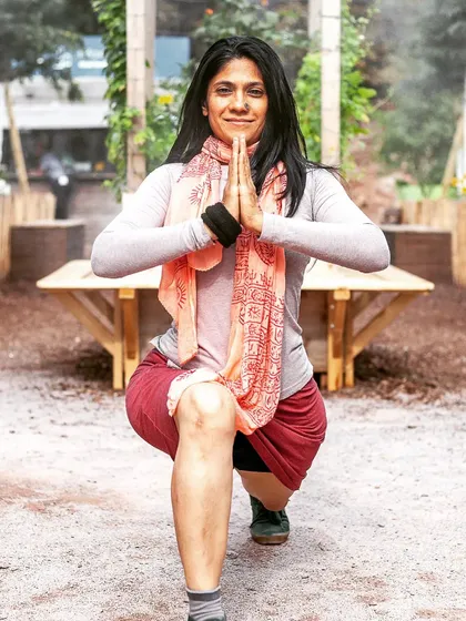 Ashwa Sanchalanasana, the equestrian pose, in a quiet park. This lunge is a reminder to stay grounded and present, channeling the infinite energy of the universe.