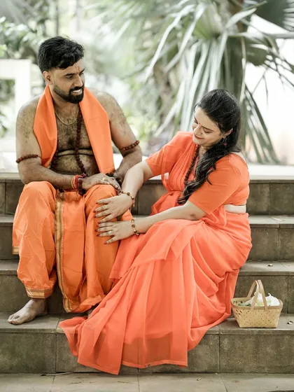 Capturing a playful and loving interaction as part of the traditional Indian maternity concept. The coordinated orange outfits and natural setting enhance the storytelling element of the shoot.