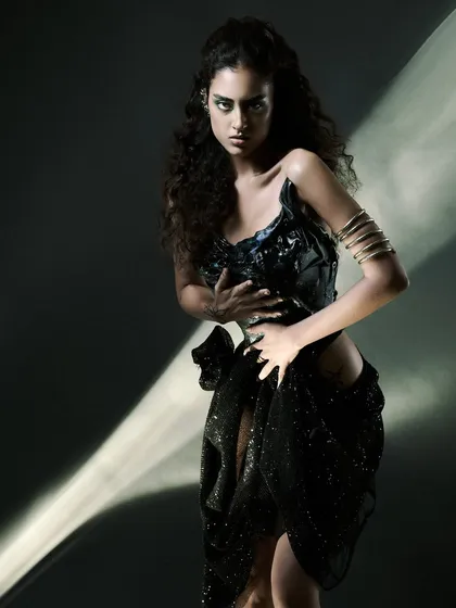 This is what I mean when I say light is my weapon. We created this shot using an optical snoot to project a sharp ray of light, cutting through the darkness. It’s about precision, control, and creating drama from a simple setup. This is the kind of technical execution that defines my work.