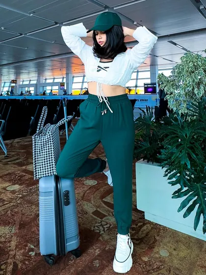 A confident pose, feeling ready for my flight. A good travel outfit should be both practical and make you feel good.