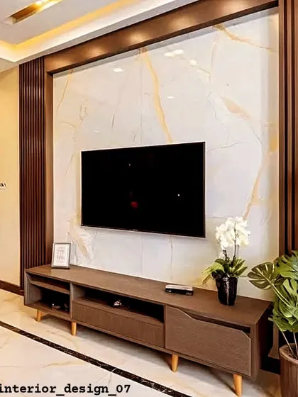 A classic combination of a wood-paneled feature wall and a simple console table. This design is timeless and brings a sense of warmth to the living room.