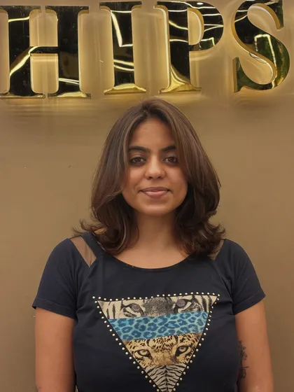 A frontal view of a client's hair transformation. The subtle highlights and layered cut create a beautiful, cohesive look that radiates confidence.