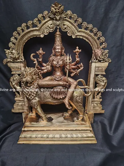 A frontal view of the Durga sculpture, highlighting the fierce expression of the lion and the calm, determined face of the goddess.