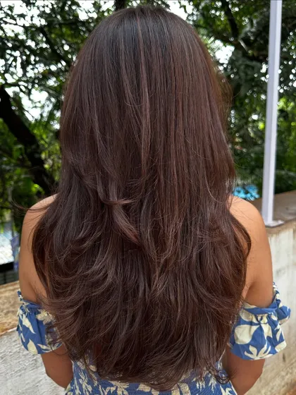 Sometimes all you need is a color refresh and a good haircut. I touched up her roots, toned her existing highlights, and gave her a fresh layered cut to bring her hair back to life.