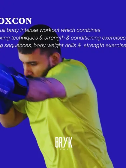 BOXCON is a full-body workout combining boxing techniques with strength and conditioning. Expect bag sequences, bodyweight drills, and strength exercises.