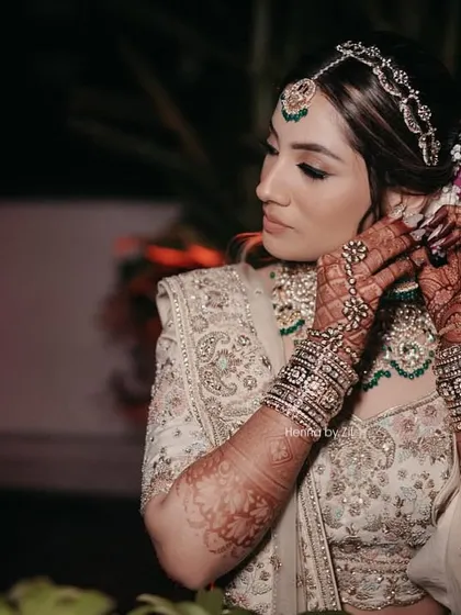 A moment of admiration for her stunning henna stain. She looks absolutely gorgeous and the dark henna completes her look.